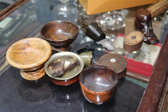 A collection of assorted early 19th century and later treen snuff boxes, four papier mache snuff boxes, a wall